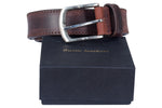 Brown leather belt with silver buckle on a 'Rustic Leather' branded box.