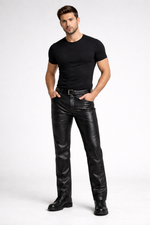 Man wearing a black t-shirt and leather pants on a white background