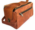 Brown leather duffel bag with zippers on a white background