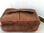 Brown leather bag on a white background