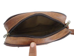 Brown leather bag with a zipper on a white background
