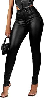 Person wearing black leather pants with a high waist, holding a handbag.