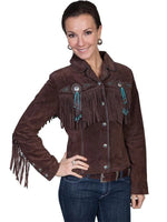 Woman wearing a brown suede jacket with fringes and bead embellishments on a white background